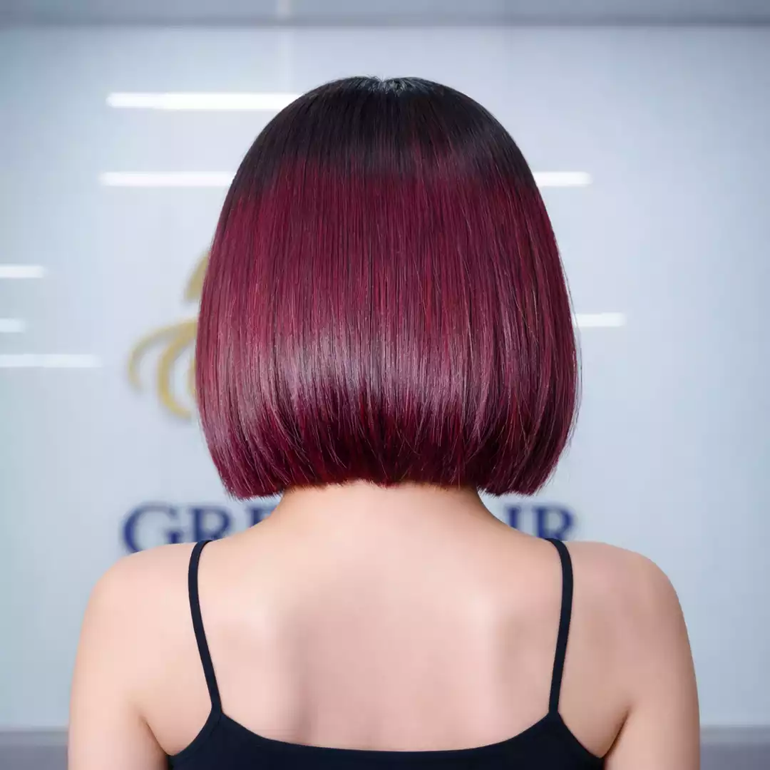 Black fringe with burgundy tones for a bold look.